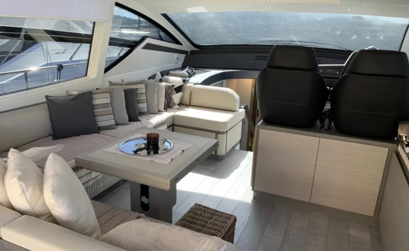  Yacht Photos Pics Luxurious interior of 2020 Pershing 62 yacht with modern seating and elegant decor.