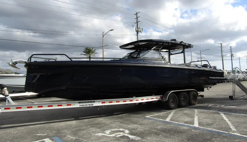  Yacht Photos Pics 2024 BRABUS Shadow 900 ST boat on trailer, parked outdoors under cloudy sky.