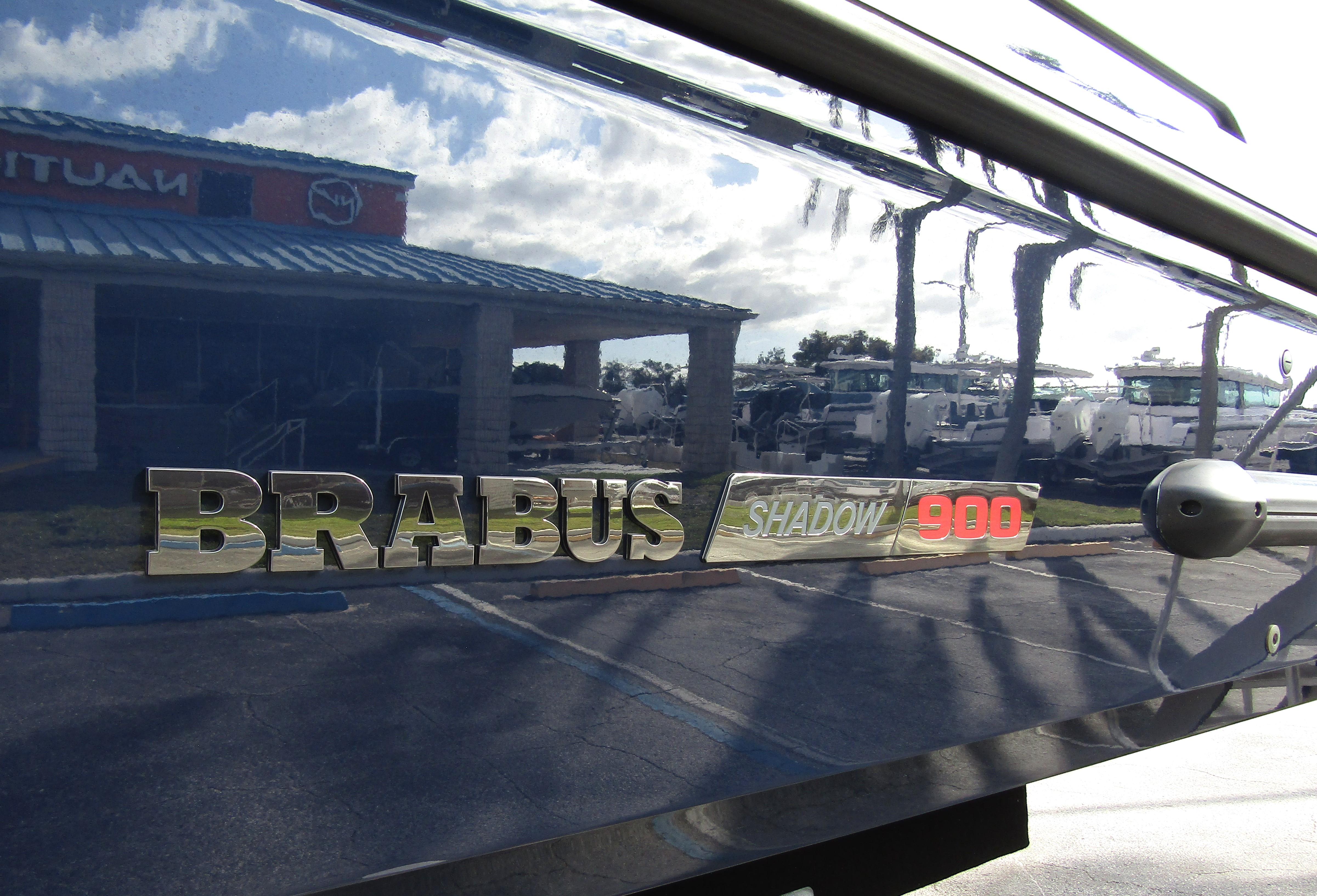 2024 BRABUS Shadow 900 ST logo on sleek boat exterior reflecting surroundings.
