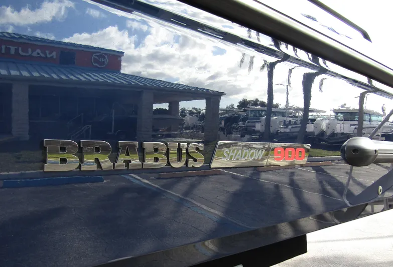  Yacht Photos Pics 2024 BRABUS Shadow 900 ST logo on sleek boat exterior reflecting surroundings.