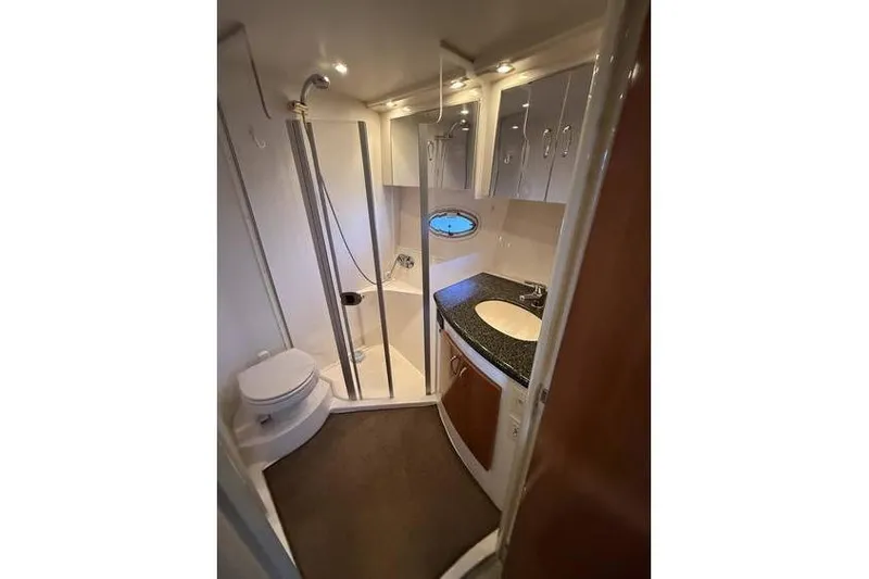  Yacht Photos Pics Bathroom interior of 2005 Carver 36 Mariner yacht with shower, sink, and toilet.