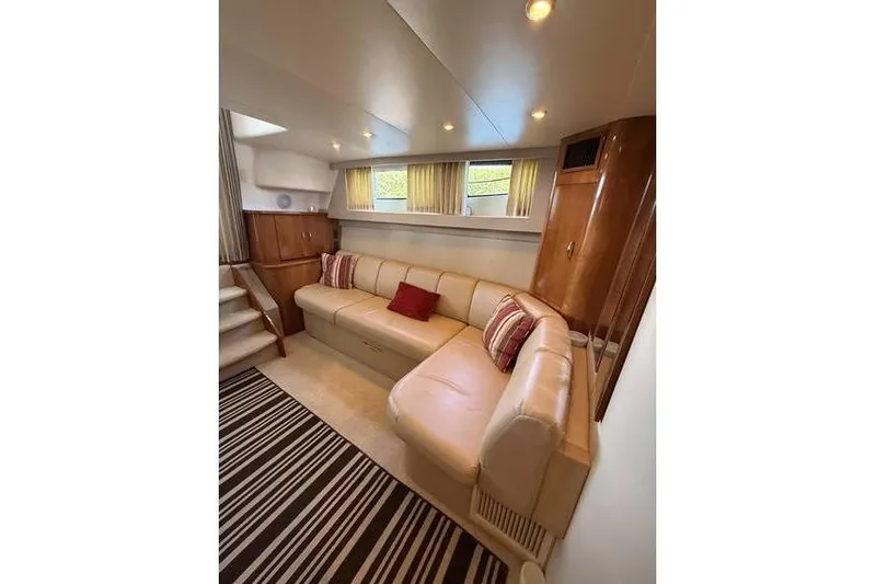  Yacht Photos Pics Luxurious interior of 2005 Carver 36 Mariner yacht with plush seating and elegant decor.