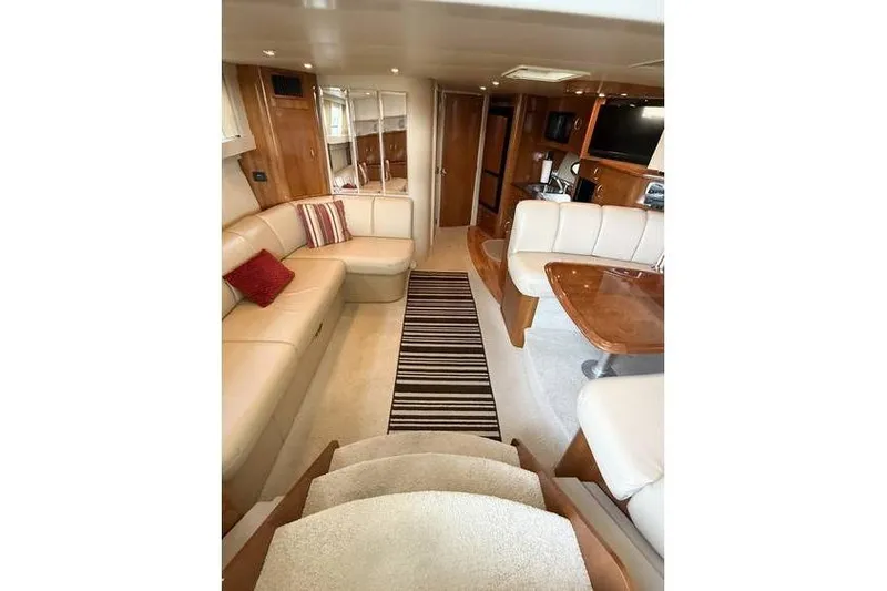  Yacht Photos Pics Interior of 2005 Carver 36 Mariner yacht with plush seating and wooden accents.