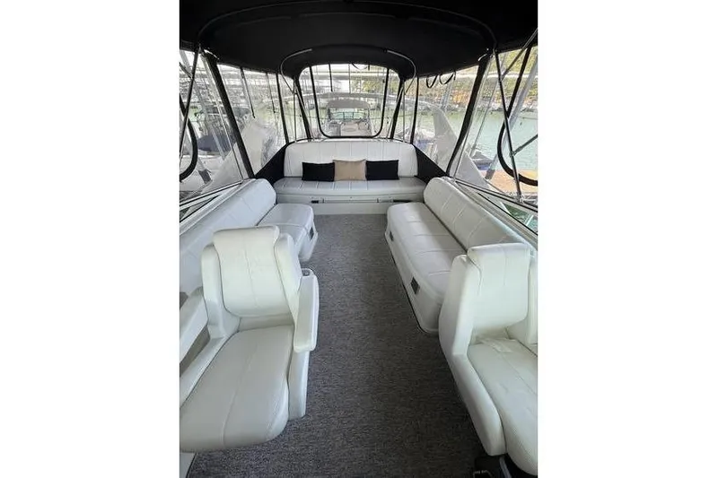  Yacht Photos Pics 2005 Carver 36 Mariner interior with white seating and spacious layout.