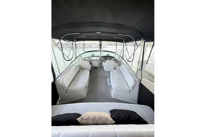  Yacht Photos Pics 2005 Carver 36 Mariner interior with spacious seating and helm, featuring elegant design.