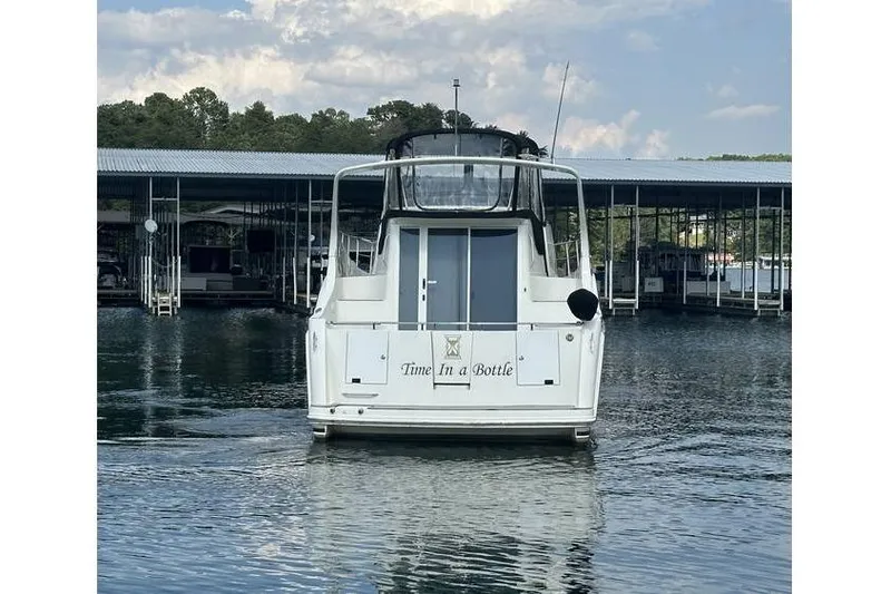  Yacht Photos Pics 2005 Carver 36 Mariner boat named "Time In a Bottle" docked at a marina.