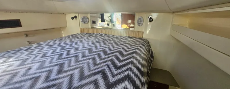 K Dee Yacht Photos Pics 2008 World Cat 320 EC cabin interior with chevron-patterned bedding.