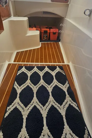 K Dee Yacht Photos Pics 2008 World Cat 320 EC interior with patterned rug and storage area.