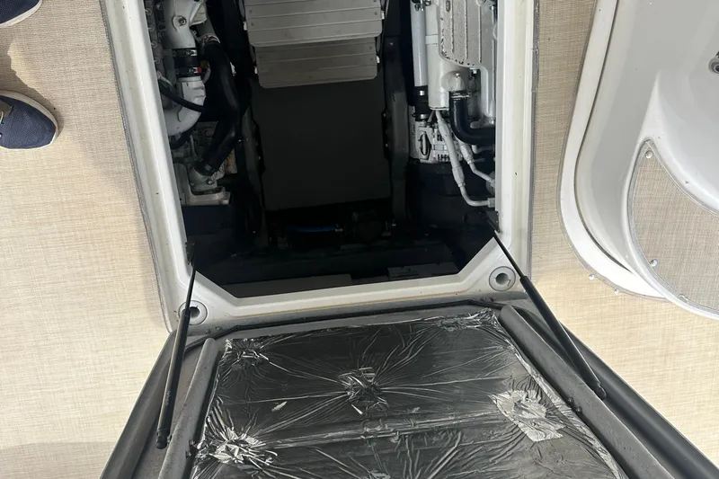  Yacht Photos Pics Engine compartment of a 2009 Meridian 441 Sedan yacht, showcasing mechanical components.