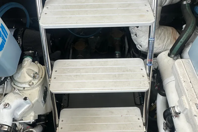  Yacht Photos Pics Engine room of 2009 Meridian 441 Sedan with metal ladder and mechanical components.