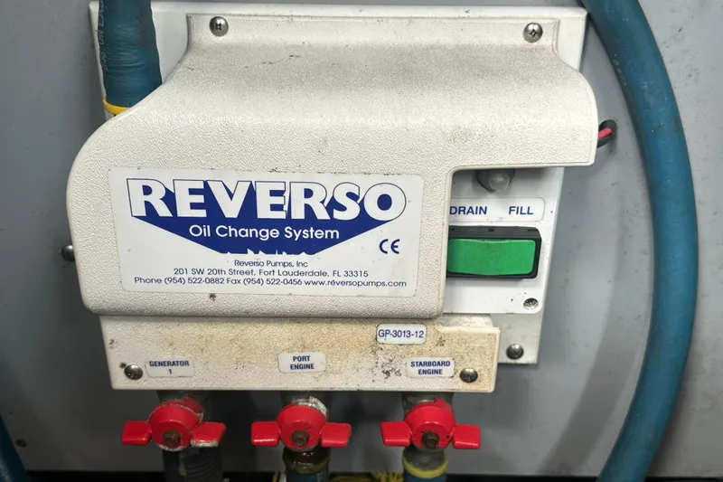  Yacht Photos Pics Reverso oil change system on 2009 Meridian 441 Sedan boat, featuring drain and fill controls.
