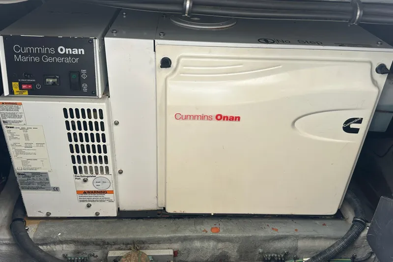  Yacht Photos Pics Cummins Onan marine generator in a 2009 Meridian 441 Sedan yacht engine room.