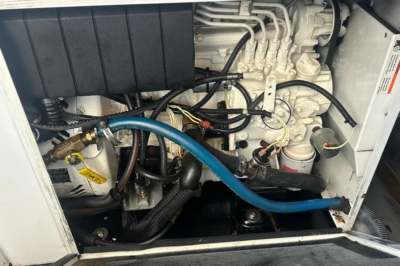  Yacht Photos Pics Engine compartment of a 2009 Meridian 441 Sedan with visible hoses and wiring.