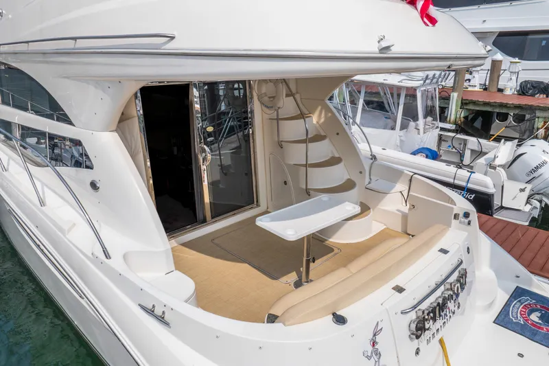  Yacht Photos Pics 2009 Meridian 441 Sedan yacht with spacious deck and elegant design at marina.