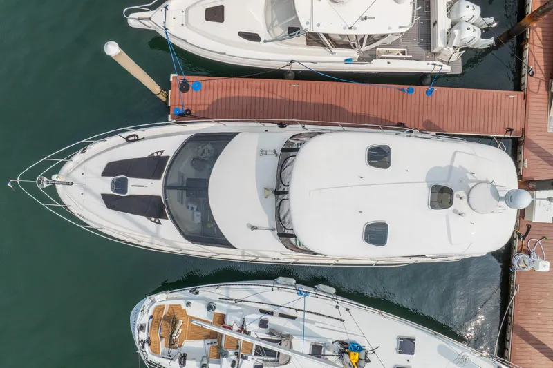  Yacht Photos Pics Aerial view of 2009 Meridian 441 Sedan yacht docked at marina.