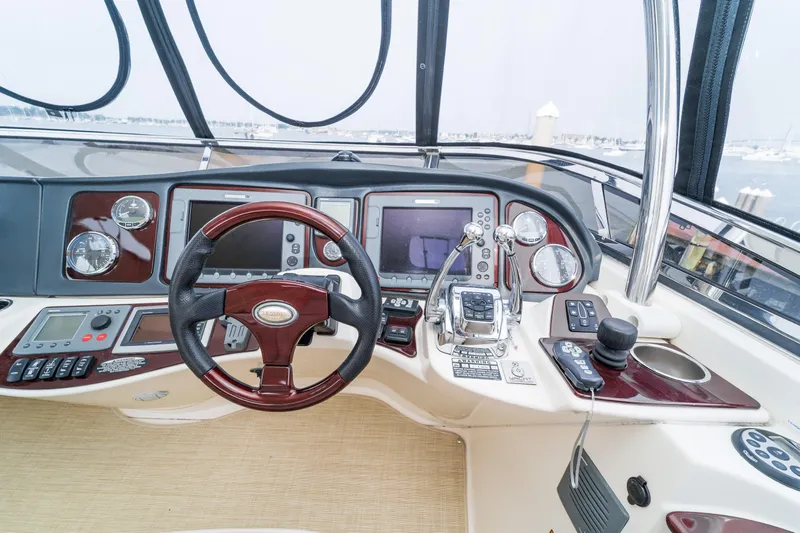  Yacht Photos Pics Helm of 2009 Meridian 441 Sedan with advanced navigation controls and steering wheel.
