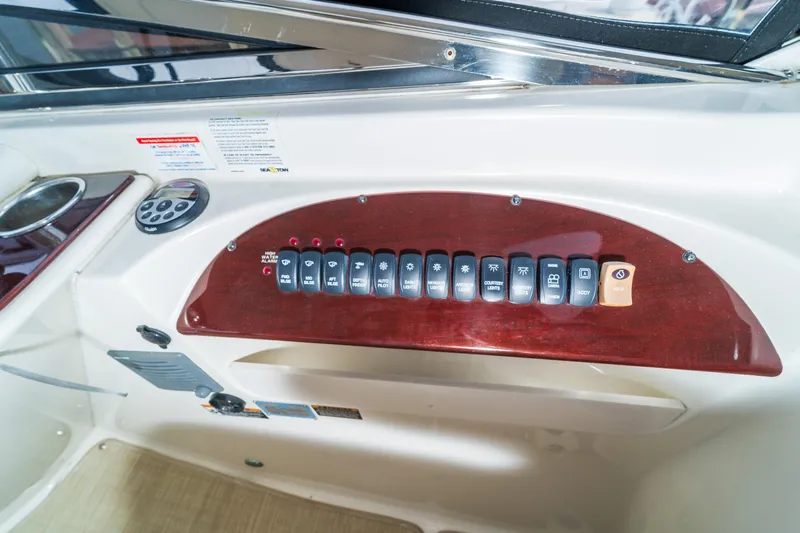  Yacht Photos Pics Control panel of a 2009 Meridian 441 Sedan yacht with labeled switches and buttons.