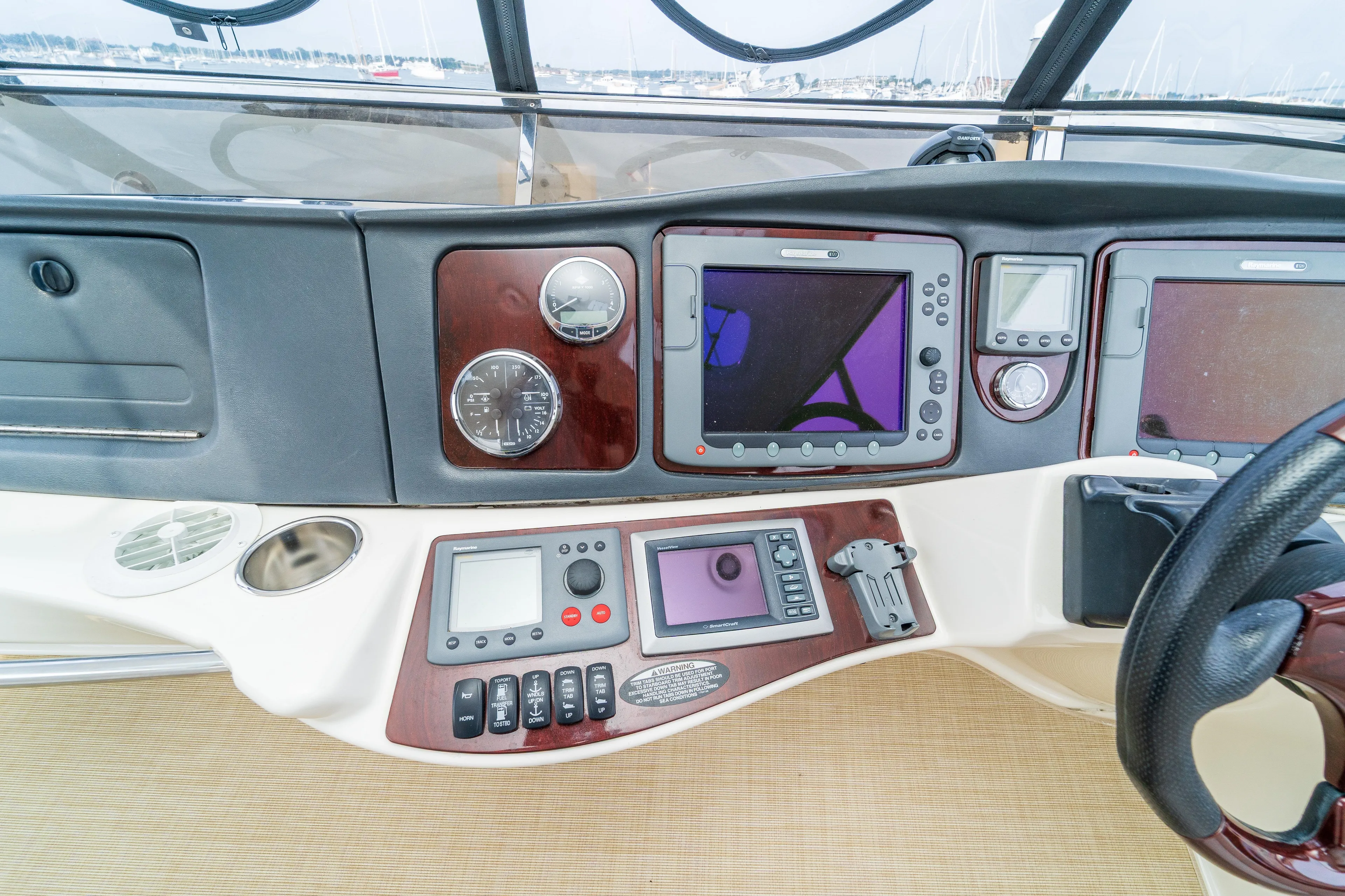  Yacht Photos Pics Helm of 2009 Meridian 441 Sedan with navigation instruments and controls.
