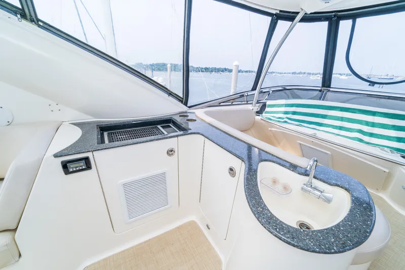  Yacht Photos Pics 2009 Meridian 441 Sedan yacht interior with sleek kitchenette and panoramic windows.