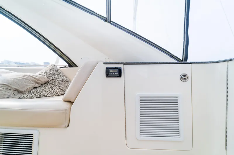  Yacht Photos Pics Interior of 2009 Meridian 441 Sedan yacht with beige seating and cushions.