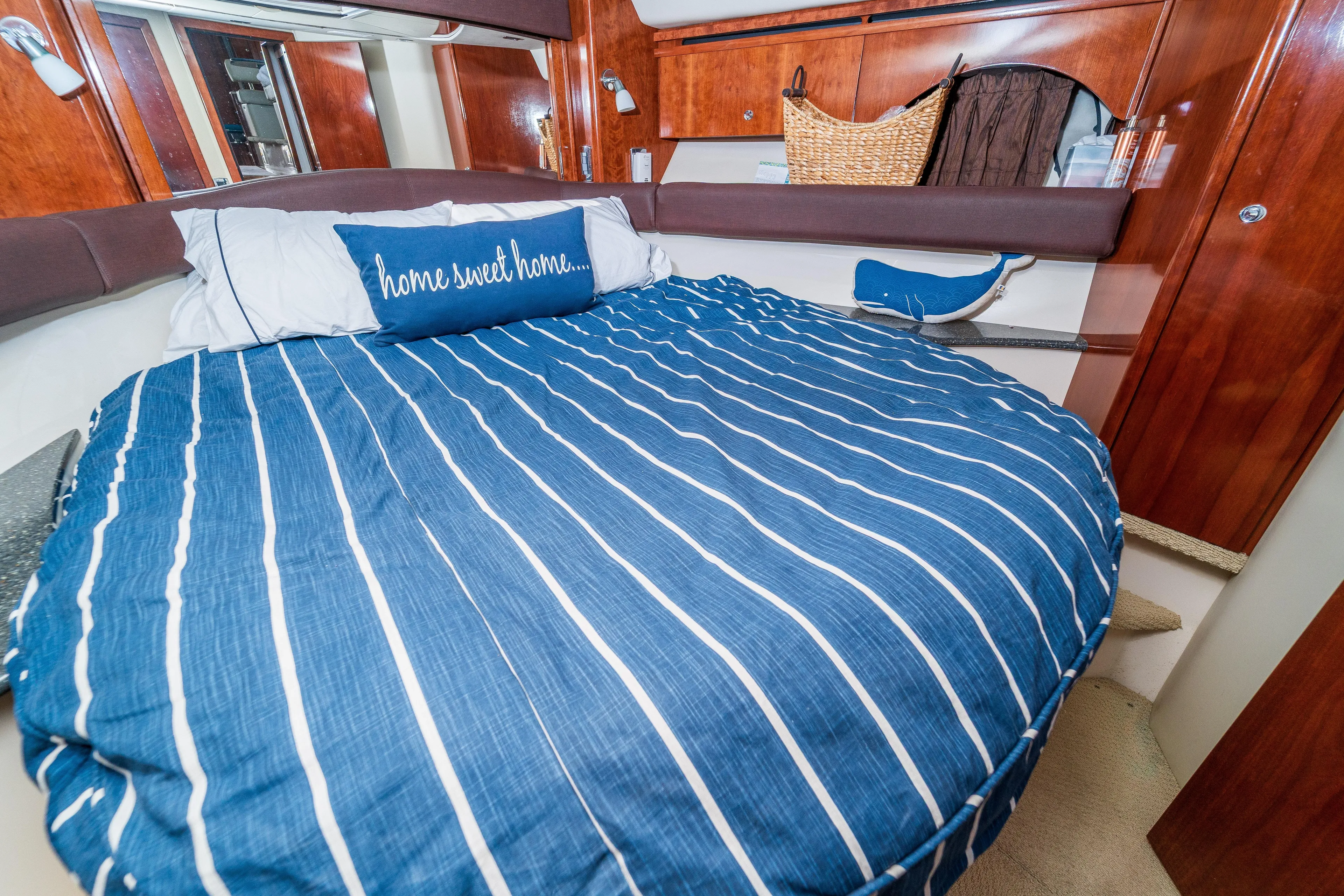  Yacht Photos Pics Cozy bedroom in 2009 Meridian 441 Sedan yacht with striped bedding and "home sweet home" pillow.