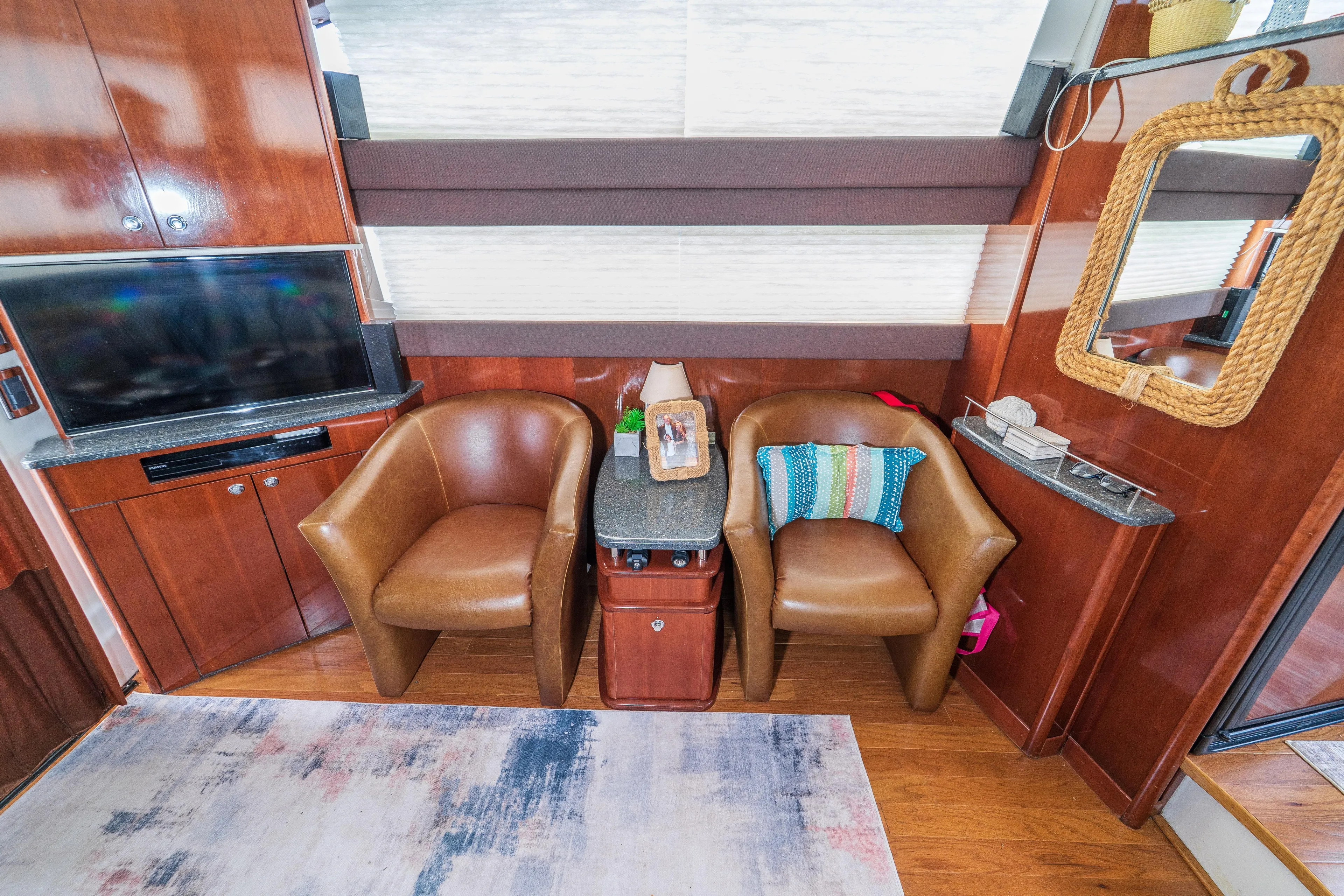  Yacht Photos Pics Luxurious 2009 Meridian 441 Sedan interior with leather chairs, TV, and nautical decor.