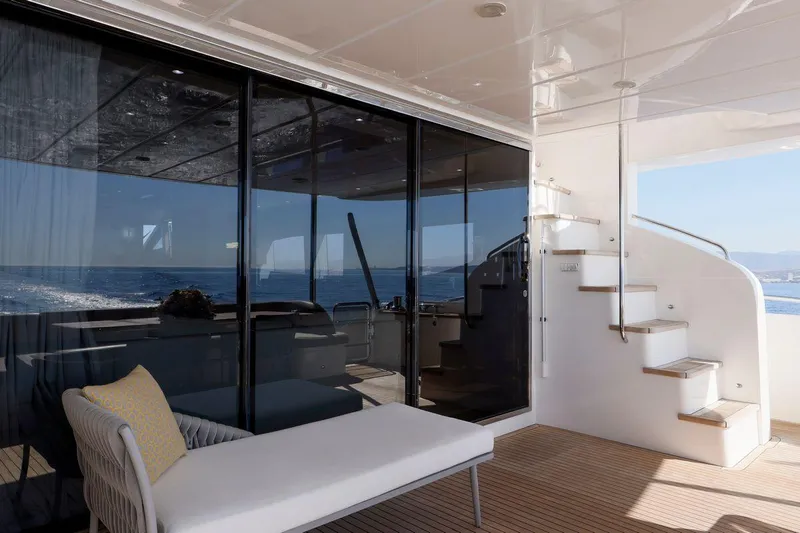  Yacht Photos Pics Luxurious 2010 Princess Flybridge 85 Motor Yacht deck with modern seating and ocean view.