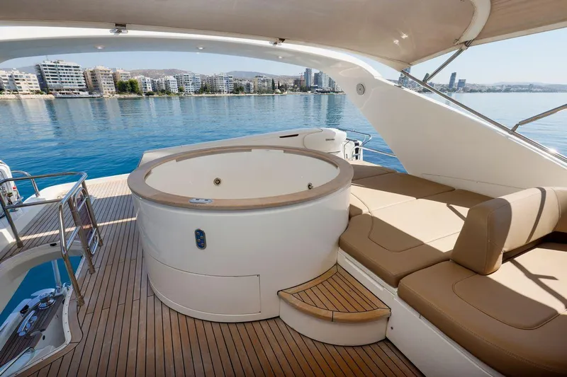  Yacht Photos Pics Luxurious 2010 Princess Flybridge 85 Motor Yacht with jacuzzi and sun loungers on deck.