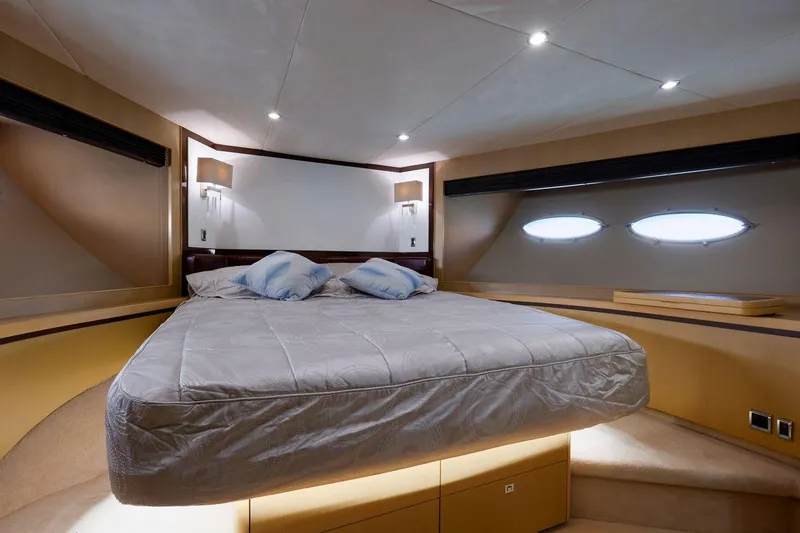  Yacht Photos Pics Luxurious bedroom interior of 2010 Princess Flybridge 85 Motor Yacht with modern lighting.