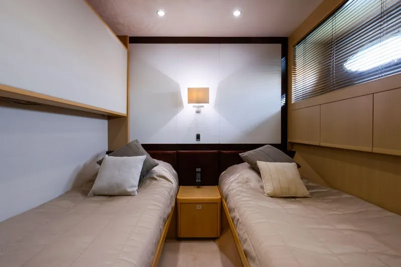  Yacht Photos Pics Luxurious twin cabin in 2010 Princess Flybridge 85 Motor Yacht, featuring modern decor and ambient lighting.