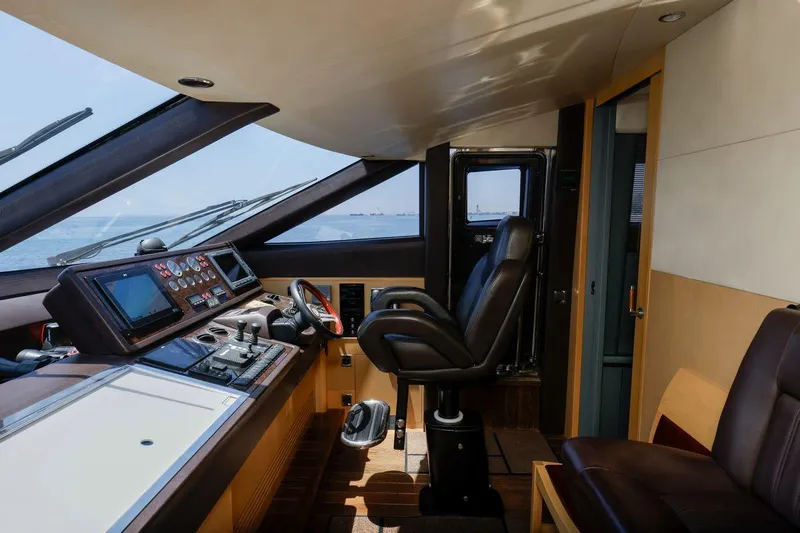  Yacht Photos Pics Luxurious helm of 2010 Princess Flybridge 85 Motor Yacht with modern navigation controls.