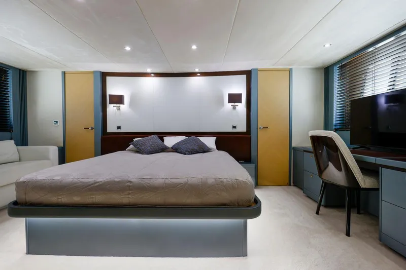  Yacht Photos Pics Luxurious bedroom interior on 2010 Princess Flybridge 85 Motor Yacht, featuring modern design and elegant furnishings.