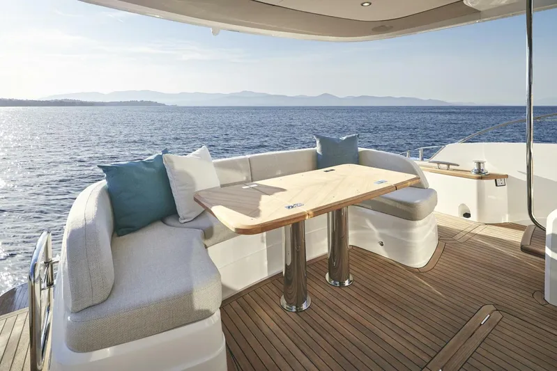  Yacht Photos Pics Luxurious 2026 Princess F65-079 yacht deck with elegant seating and ocean view.