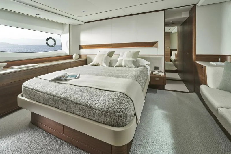  Yacht Photos Pics Luxurious bedroom interior of 2026 Princess F65-079 yacht with ocean view.