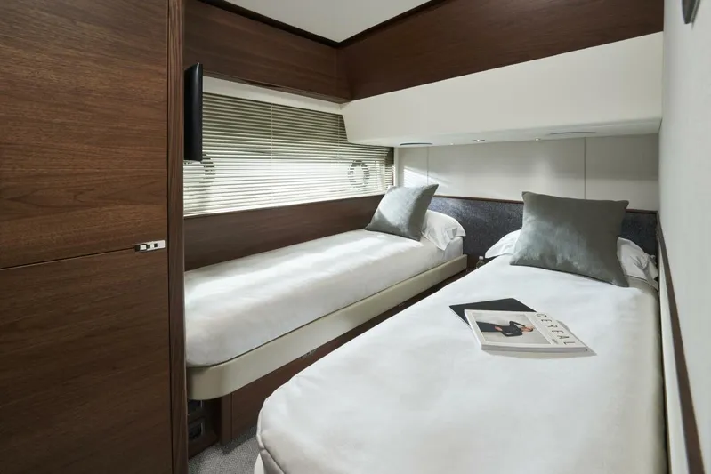  Yacht Photos Pics Luxurious twin cabin in 2026 Princess F65-079 yacht with modern decor and plush bedding.