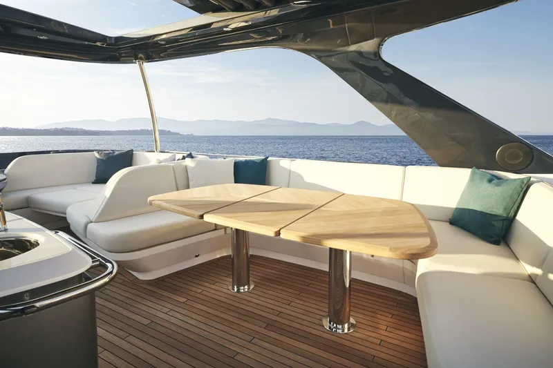  Yacht Photos Pics Luxurious 2026 Princess F65-079 yacht deck with elegant seating and ocean view.