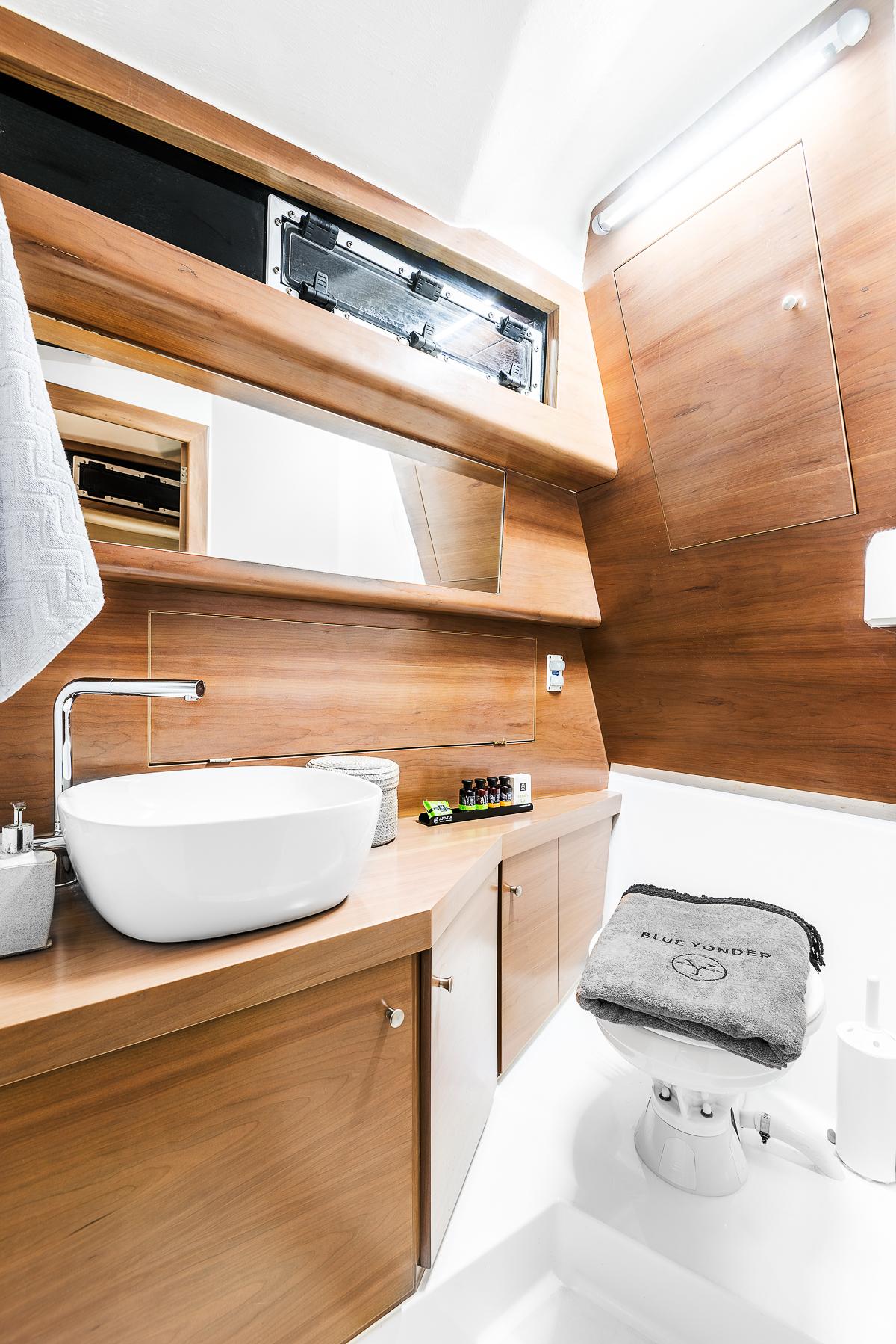 Modern bathroom in 2017 Skipper 120S Desire yacht with wood accents and sleek fixtures.