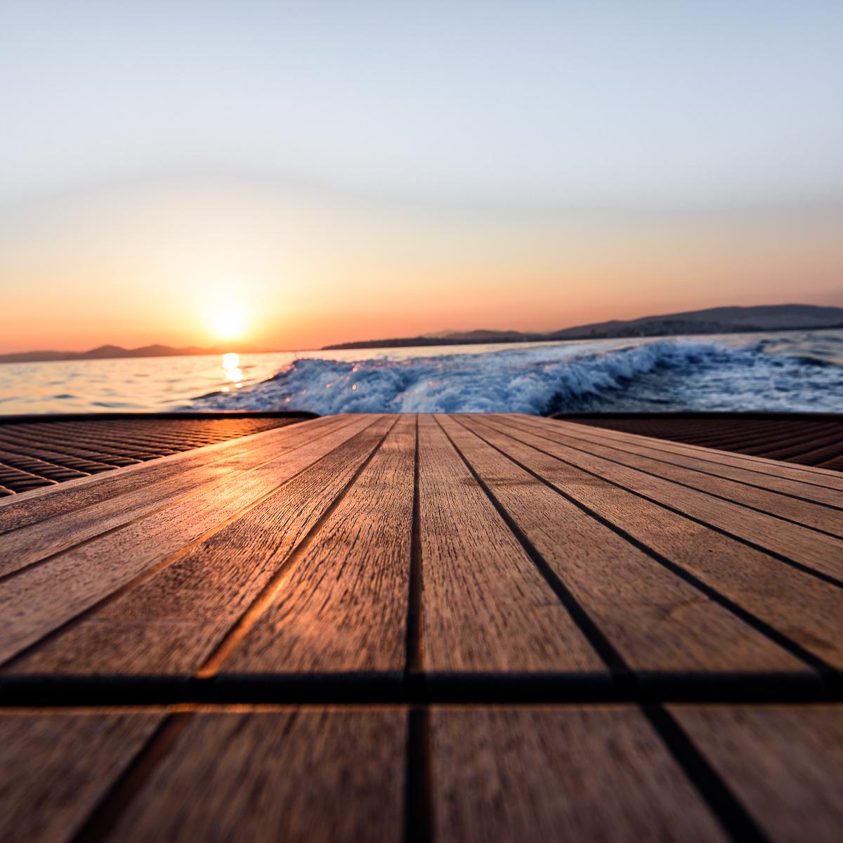 Sunset view from Skipper 120S Desire yacht deck, 2017 model, with ocean waves.
