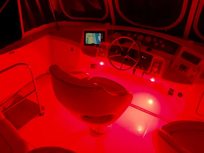  Yacht Photos Pics 2006 Silverton 34 Convertible boat cockpit with red lighting and navigation equipment.