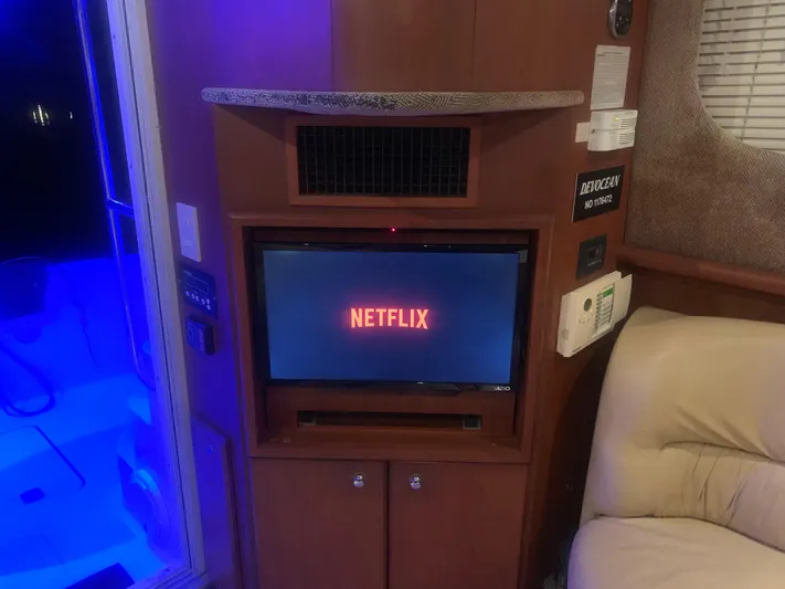  Yacht Photos Pics Interior of 2006 Silverton 34 Convertible yacht with Netflix on TV screen.