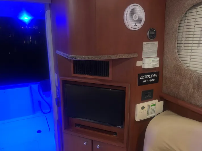  Yacht Photos Pics Interior of a 2006 Silverton 34 Convertible yacht with TV and blue ambient lighting.