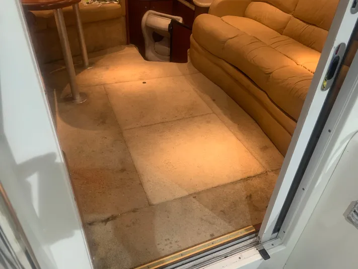  Yacht Photos Pics Interior of a 2006 Silverton 34 Convertible boat with beige seating and carpeted floor.