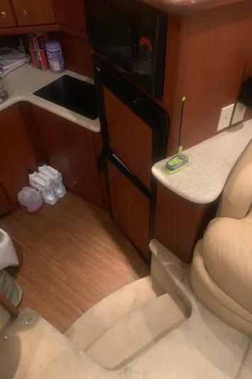  Yacht Photos Pics Interior of 2006 Silverton 34 Convertible yacht, featuring kitchen and seating area.