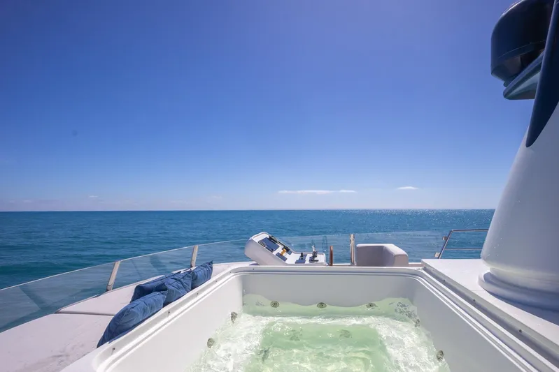 Phoenix Yacht Photos Pics Luxurious Sanlorenzo SD112 yacht with jacuzzi, ocean view, and clear blue sky.