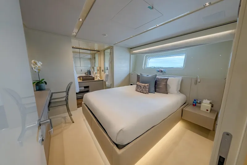 Phoenix Yacht Photos Pics Luxurious bedroom interior of 2019 Sanlorenzo SD112 yacht with modern decor and ocean view.