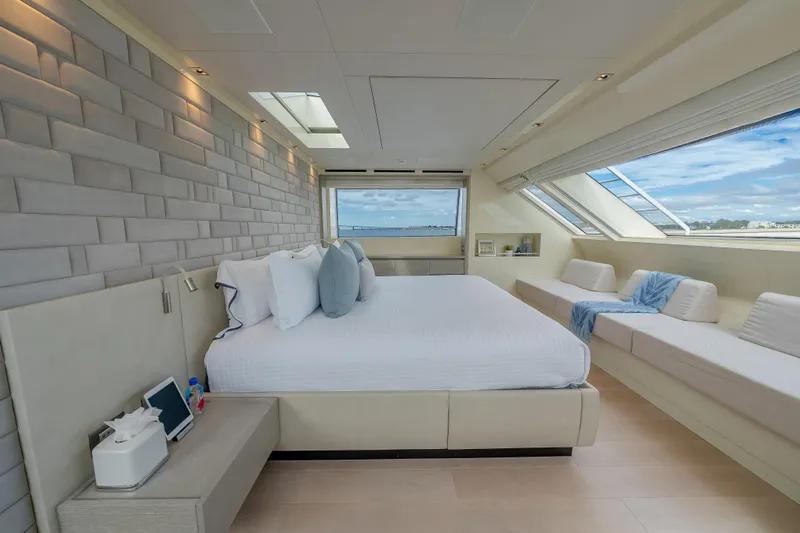 Phoenix Yacht Photos Pics Luxurious bedroom interior of 2019 Sanlorenzo SD112 yacht with panoramic windows and modern decor.