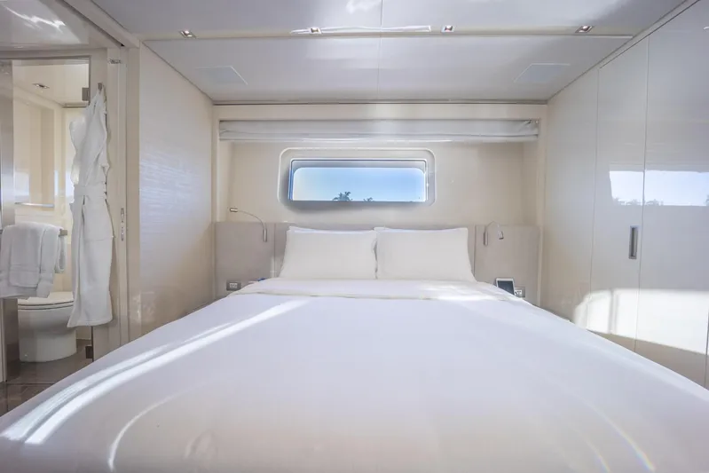 Phoenix Yacht Photos Pics Luxurious bedroom interior of 2019 Sanlorenzo SD112 yacht with modern design and window view.
