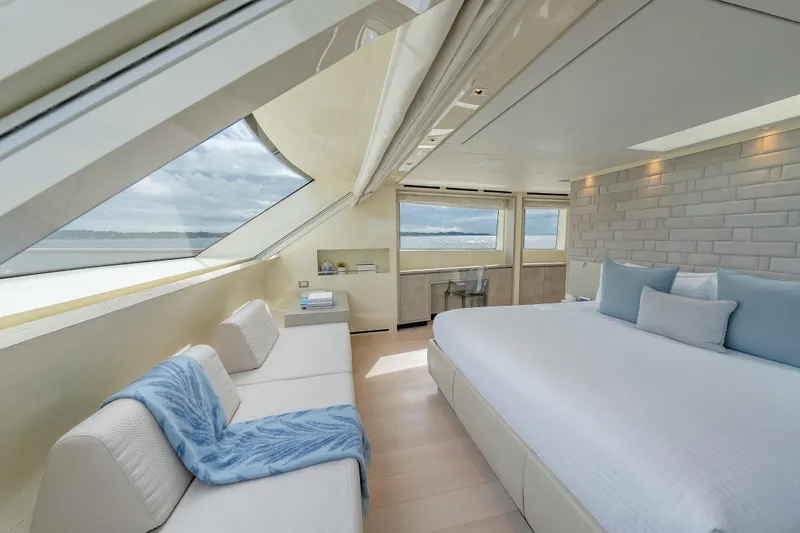 Phoenix Yacht Photos Pics Luxurious Sanlorenzo SD112 yacht bedroom with ocean view, modern decor, and elegant furnishings.