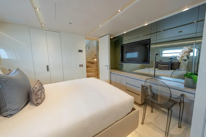 Phoenix Yacht Photos Pics Luxurious bedroom interior of 2019 Sanlorenzo SD112 yacht with modern decor and elegant furnishings.