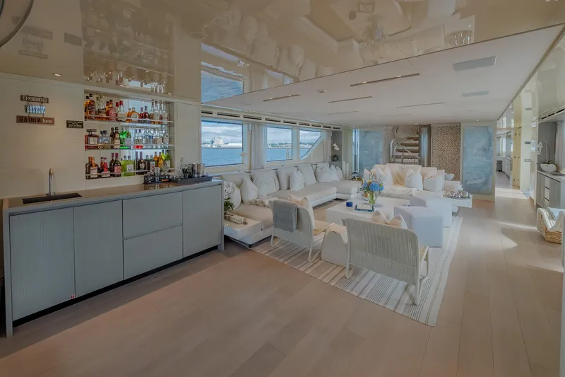 Phoenix Yacht Photos Pics Luxurious interior of 2019 Sanlorenzo SD112 yacht with elegant seating and bar area.